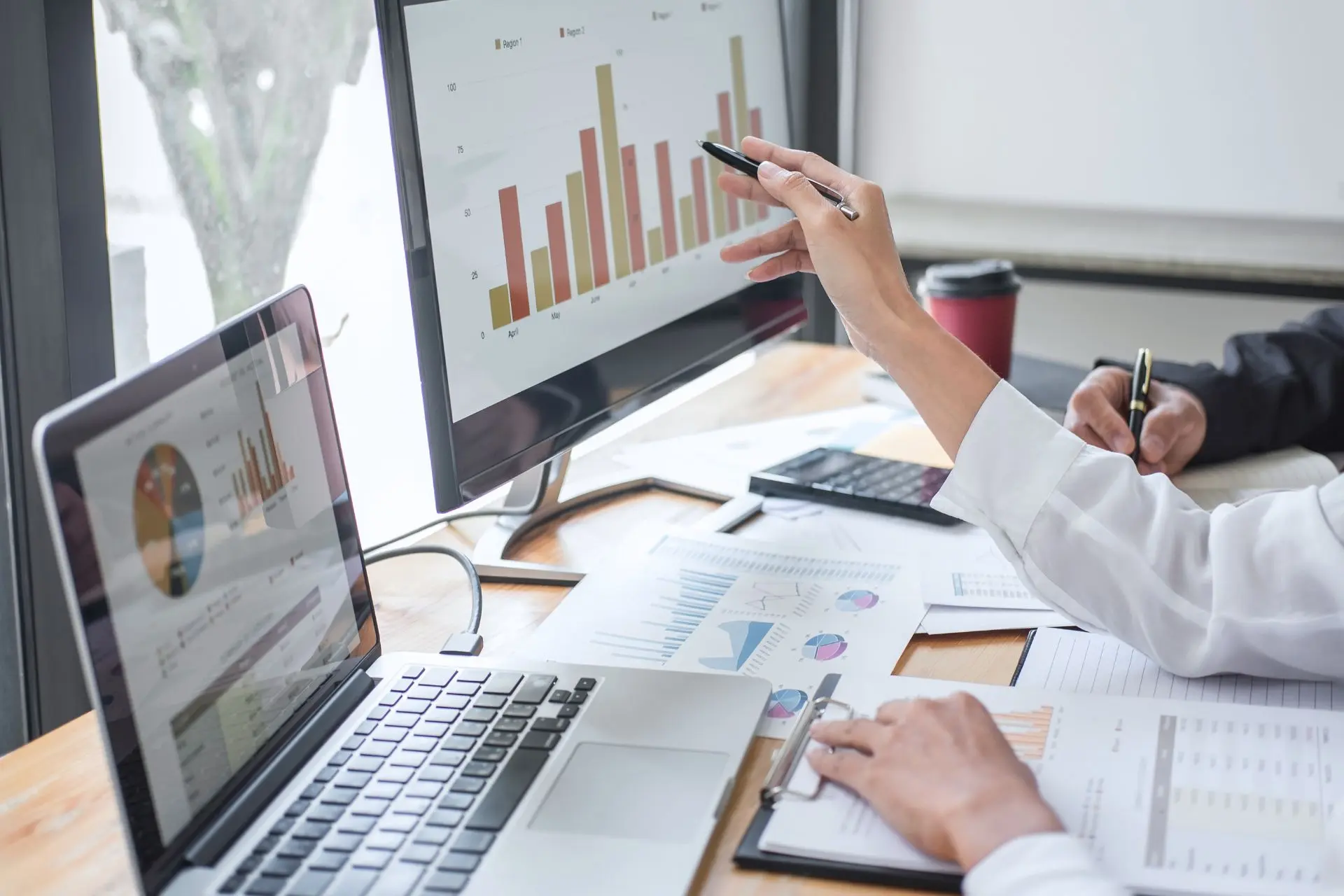 analyzing data charts on a large screen for device monitoring